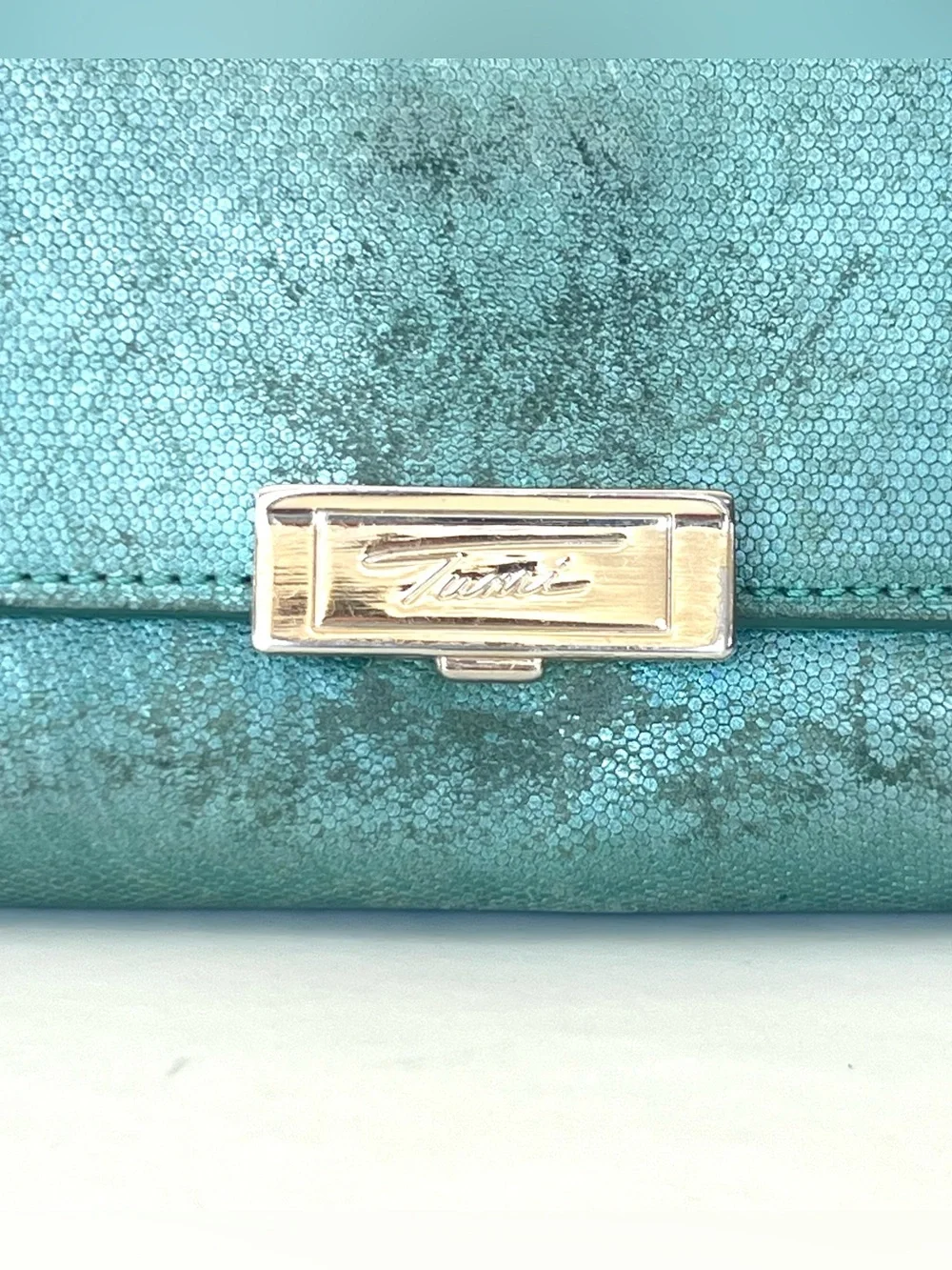 TUMI Sage Shimmer Green Leather Flap Closure Dual Compartment Spacious Wallet
